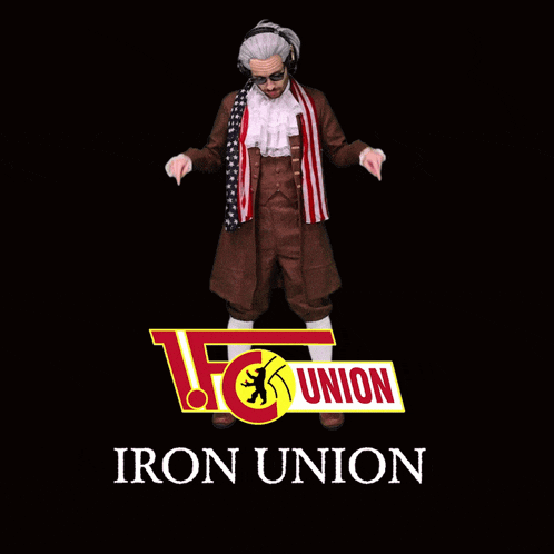 a man in a suit stands in front of a union sign