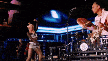 a man playing drums with a shirt that says po