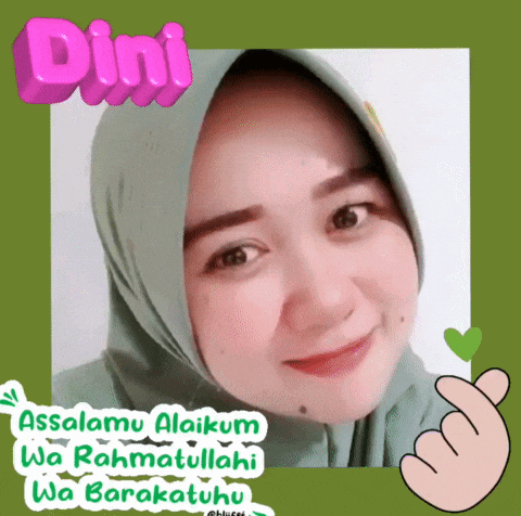 a woman in a green hijab is smiling and making a heart with her hand