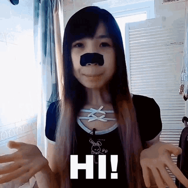 a girl with a mustache on her nose is saying hi