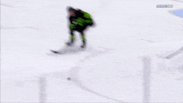 a hockey player with the number 58 on his jersey is holding a hockey stick