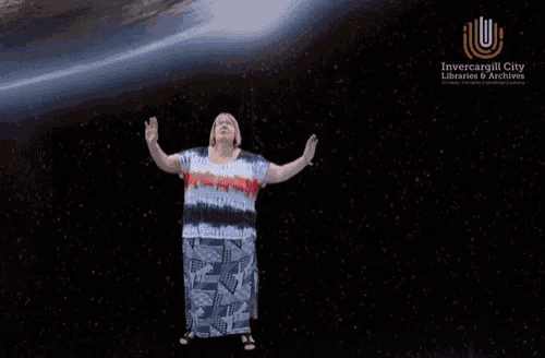 a woman is floating in space with a book titled space