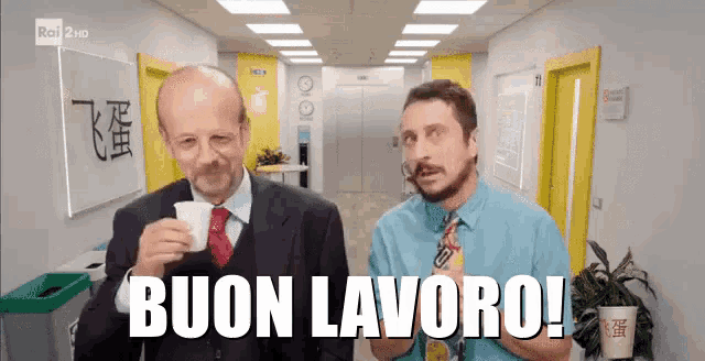 two men standing next to each other in a hallway with the words buon lavoro written on the screen