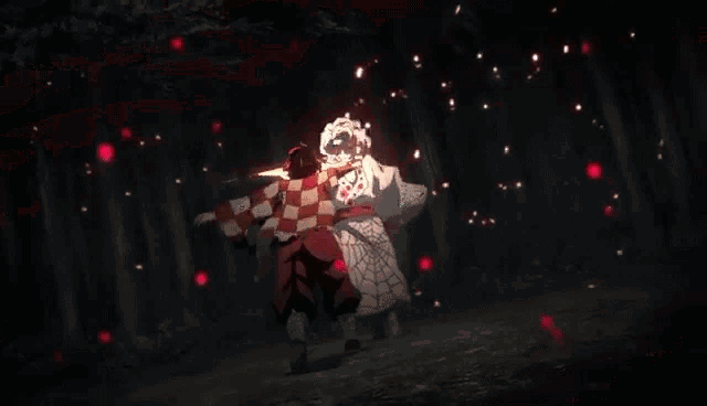 a person is holding a sword with a red light coming out of it in a dark forest .
