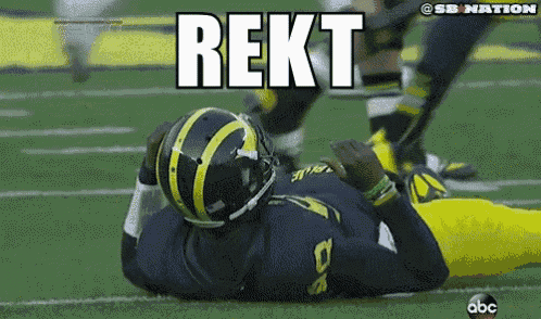 a football player is laying on the field with the word rekt written above him