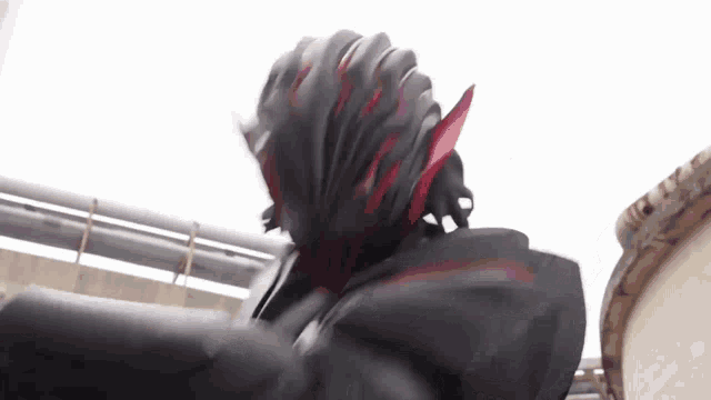 a close up of a person wearing a black helmet and a black jacket .