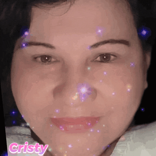 a close up of a woman 's face with the word cristy on the bottom right