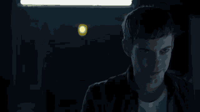 a man wearing a yellow smiley face on his face