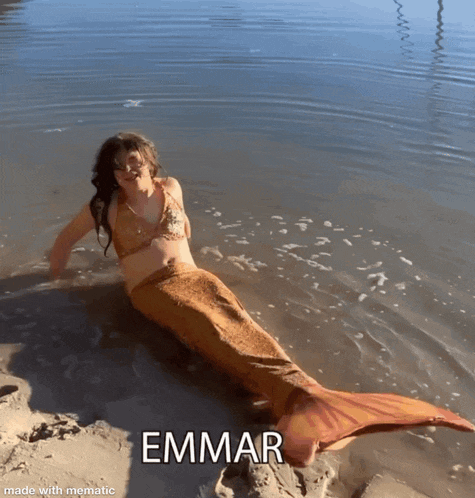 a woman in a mermaid costume is laying in the water with the name emma written below her