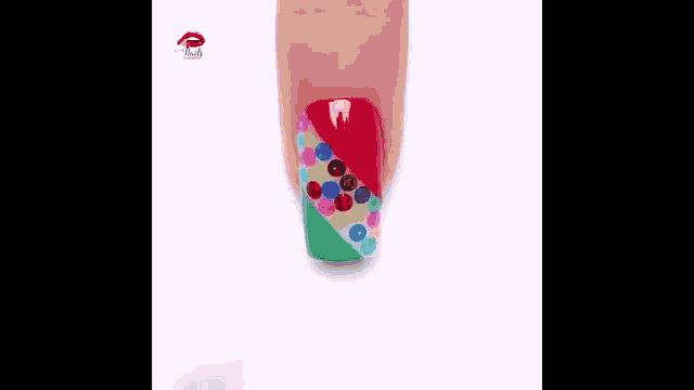 a close up of a woman 's nails with a polka dot design