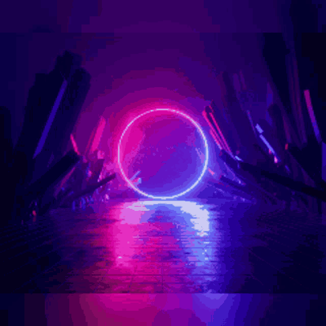 a neon circle is glowing in the dark in a dark room