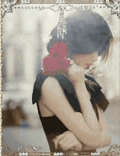 a woman with a red rose in her hair is in a picture frame