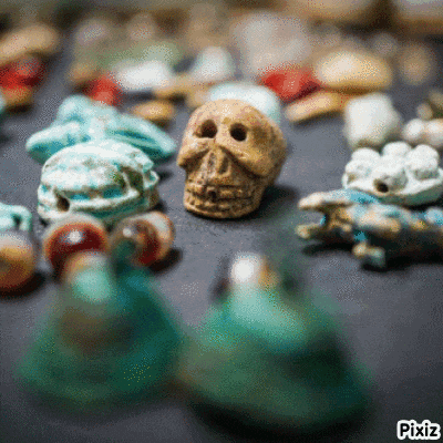 a pile of skulls and frogs with pixiz written on the bottom right corner