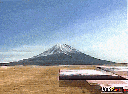 a picture of a mountain with the word vcr partially visible in the corner