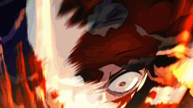 a close up of a person 's face with flames coming out of it 's eyes .