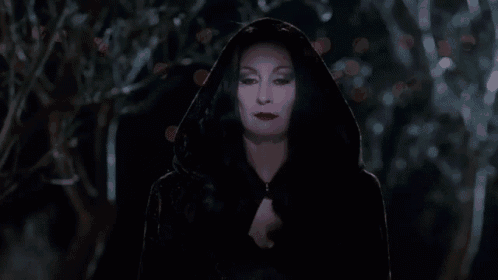 a woman in a black cape with a hood and the words sleepless night written below her