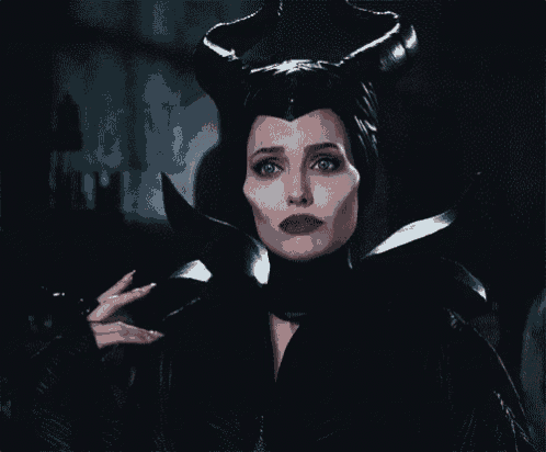 a woman in a costume with horns on her head