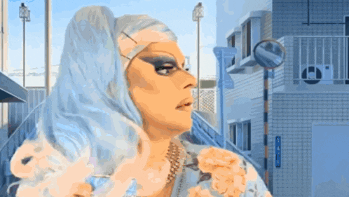 a drag queen is standing in front of a blue building