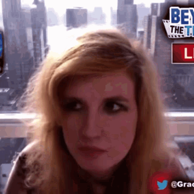 a woman in front of a sign that says bey