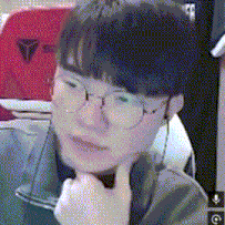a close up of a person wearing glasses with their hand on their chin