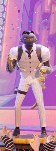a man in a suit and tie holds a trophy in his hand