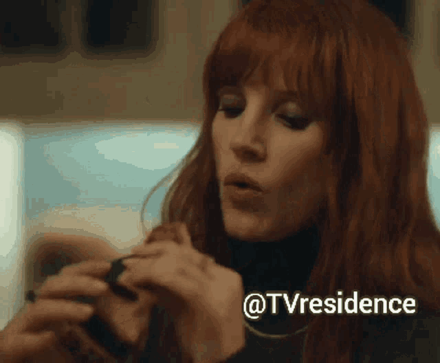 a close up of a woman 's face with the words " @tvresidence " next to her