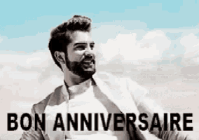 a man with a beard is smiling in a black and white photo with the words bon anniversaire written on the bottom .