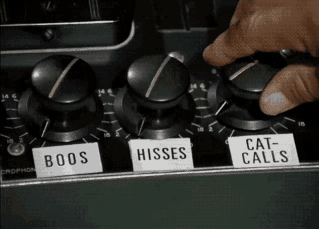 a person is adjusting a knob that says boos on it