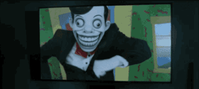 a tv screen shows a cartoon character with a big smile