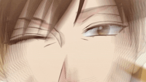 a close up of a person 's eyes with a slight smirk on their face .