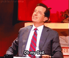a man in a suit says oh my god