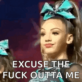 a cheerleader with a blue bow on her head is saying `` excuse the fuck outa me '' .