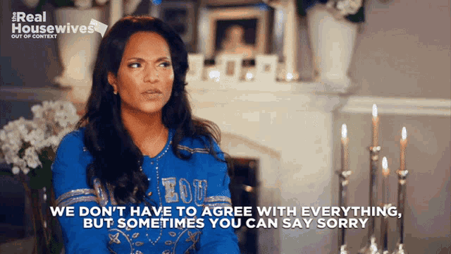 a woman in a blue shirt says we don t have to agree with everything but sometimes you can say sorry