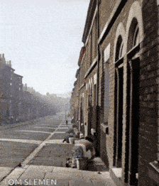 a photo of a row of brick buildings taken by tom sleman