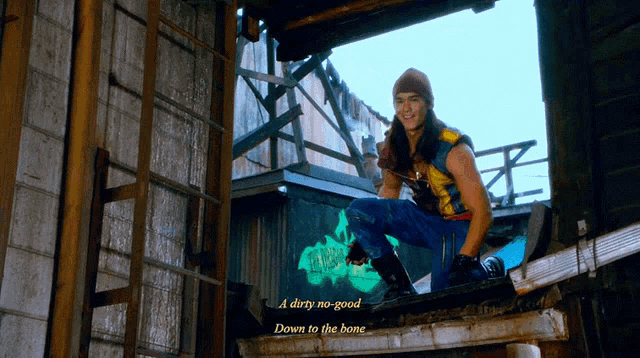 a dirty no-good down to the bone is written on a wall