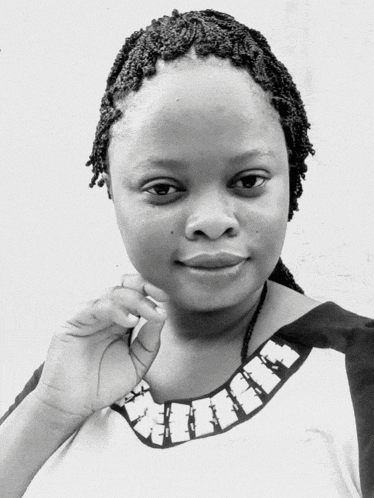 a black and white photo of a woman with braids and a necklace