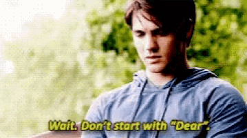 a man in a blue hoodie is talking to another man and says wait , don 't start with " dear " .