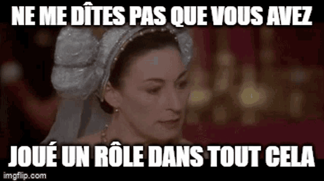 a woman in a white dress and a white headpiece is looking at the camera with a caption .