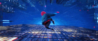a person in a blue hoodie is jumping through the air