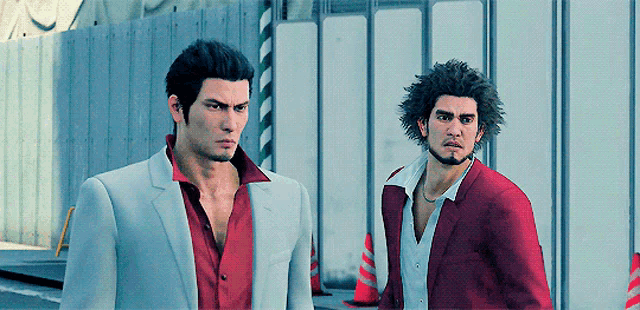 two men in suits and shirts are standing next to each other in front of a building .
