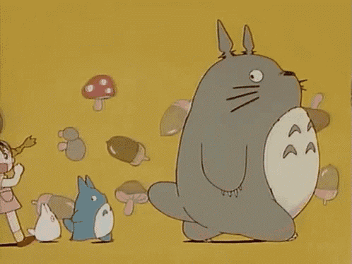 a cartoon of a totoro standing next to a girl and a mushroom .