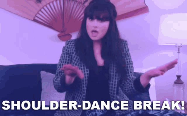 a woman is sitting on a couch with the words shoulder-dance break written on the bottom