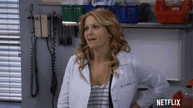 a woman in a lab coat stands in front of a netflix logo