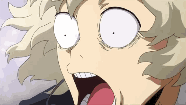 a close up of a person 's face with a surprised look on their face