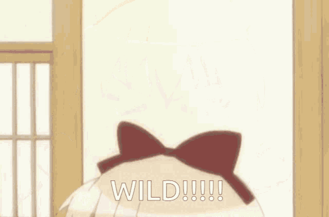 a girl with a red bow on her head is saying wild !!!