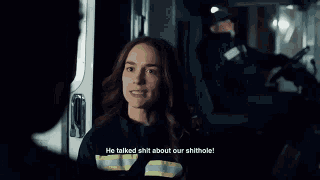 a woman in an ambulance is talking to a man and says he talked shit about our shithole .