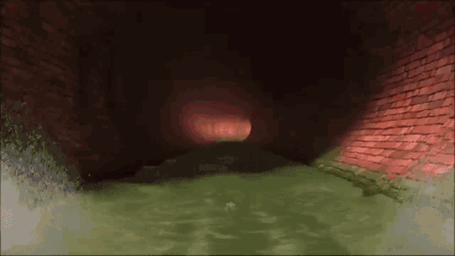 a dark tunnel with a red light coming out of it