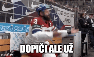 a hockey player with the number 3 on his jersey is sitting on a bench with his hands in the air