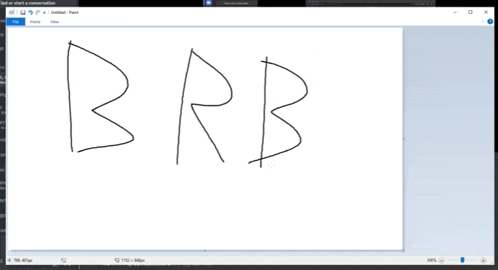a computer screen shows the word brb written on it