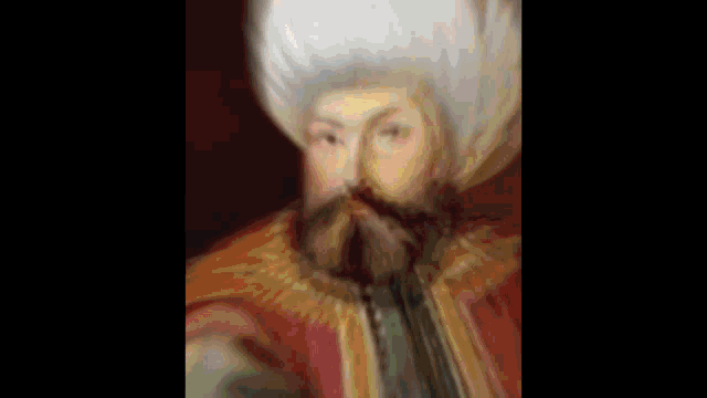 a blurry painting of a man with a beard and a turban